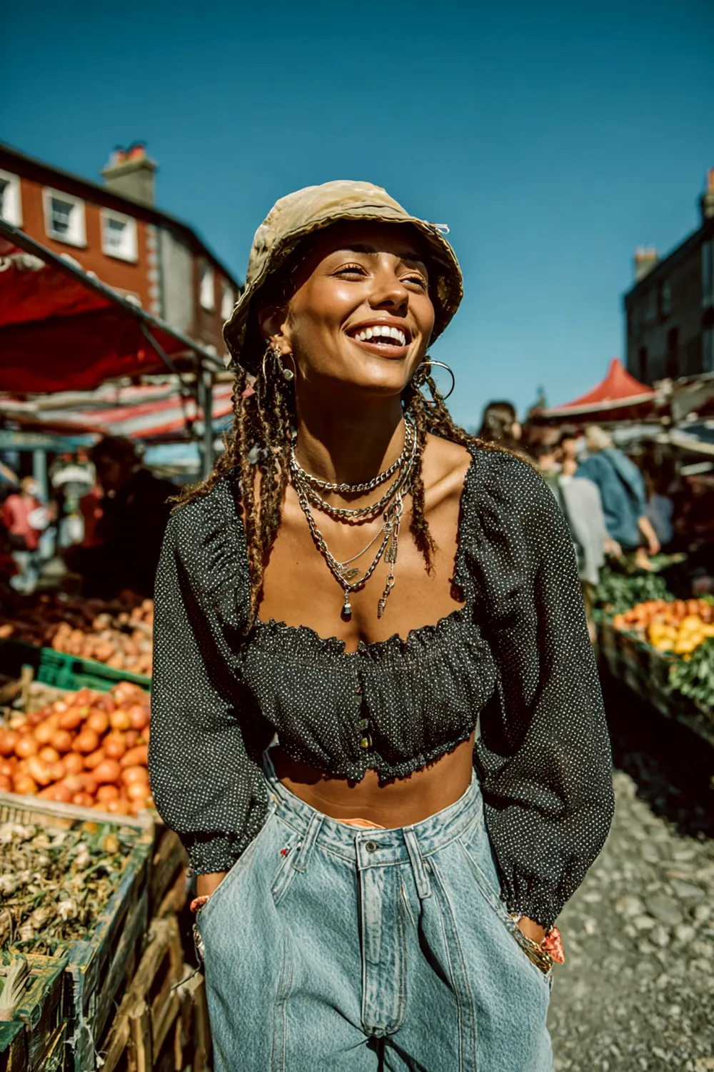 Smiling woman in 90s mom jeans with bucket hat crop top and layered necklaces walking through outdoor market
