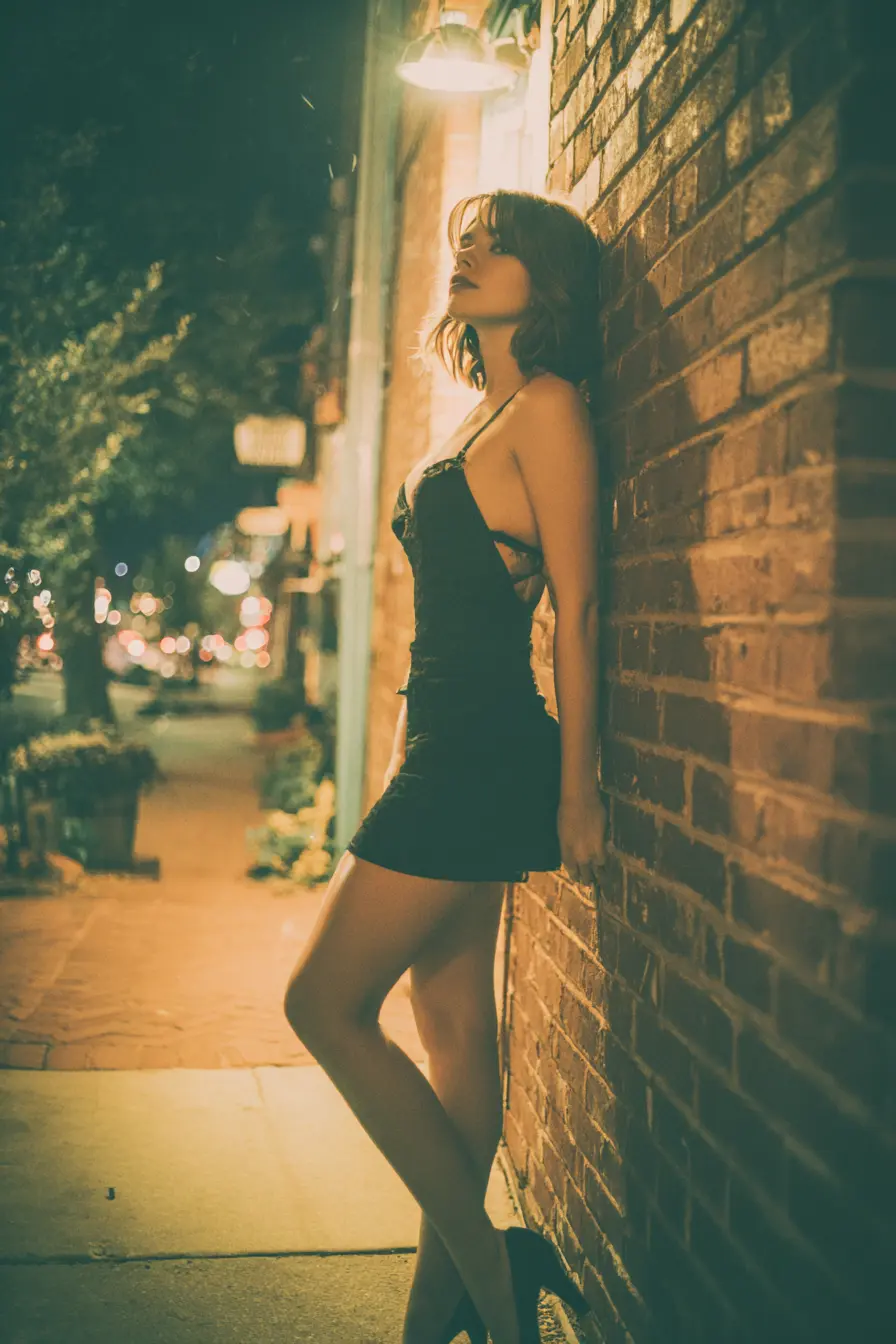 petite girl in black spaghetti strap bodycon mini dress with kitten heels