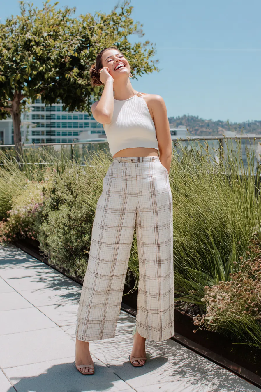 light plaid pants outfit with cream crop top and heeled sandals warm weather
